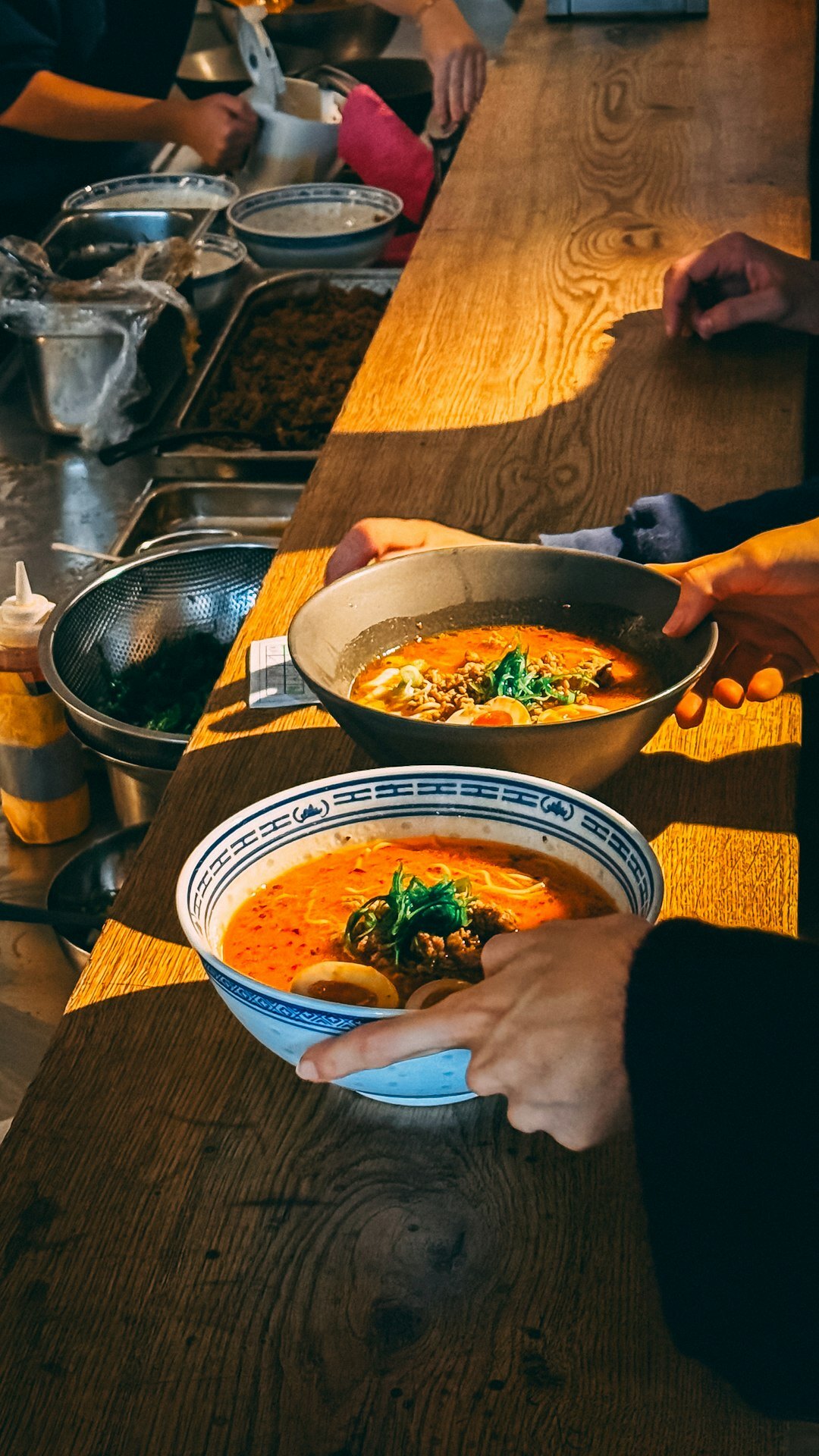 person ladling soup