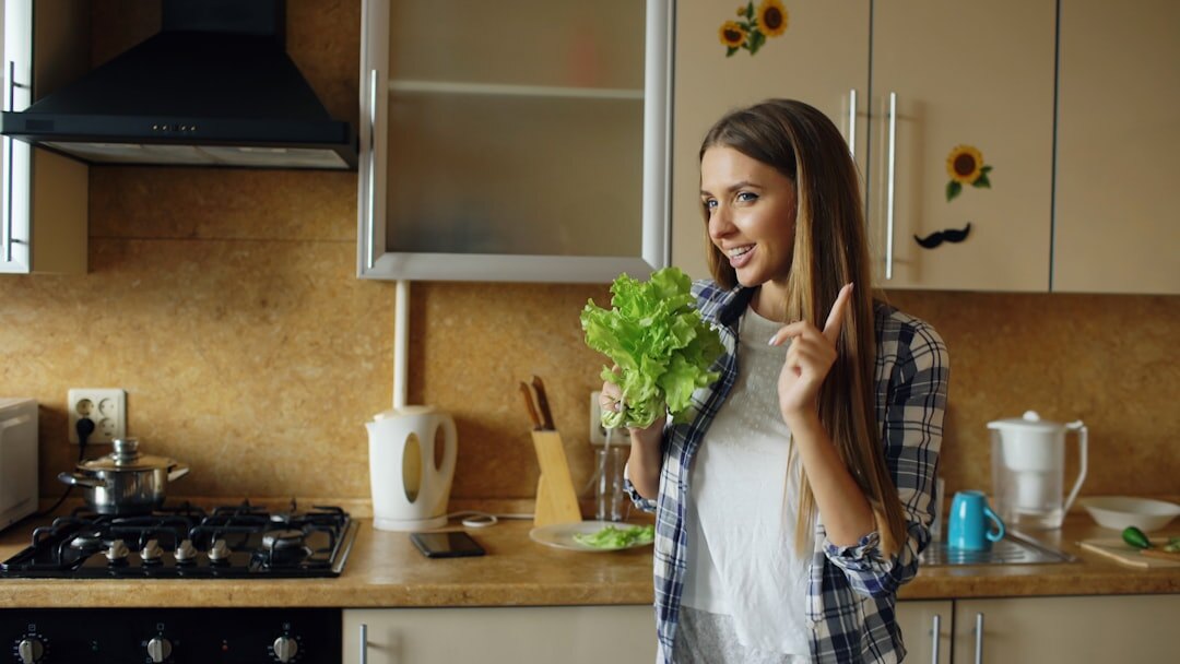 Portrait of a middle-aged Czech woman smiling in a home kitchen